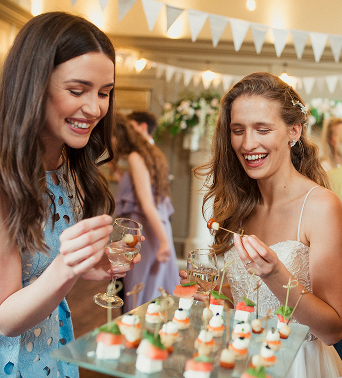 a group of women smiling at each other