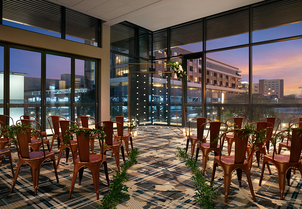 a room with chairs and flowers main