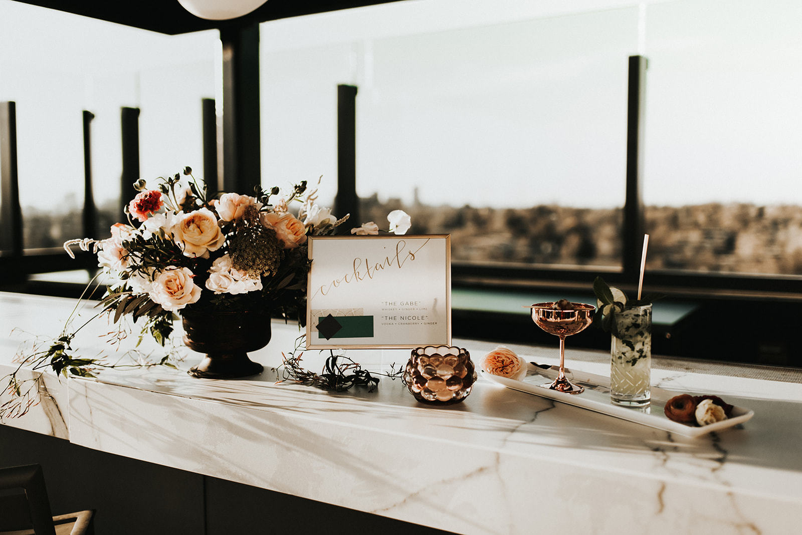 a table with flowers and drinks on it main