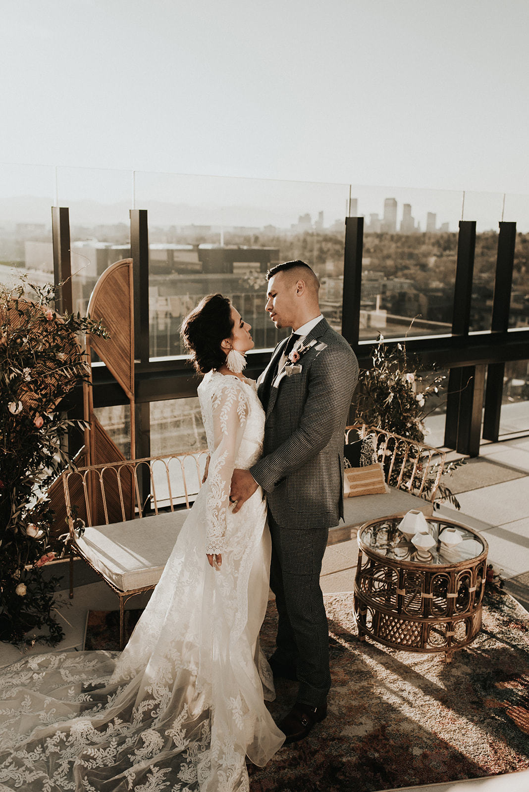 a man and woman standing in front of a window