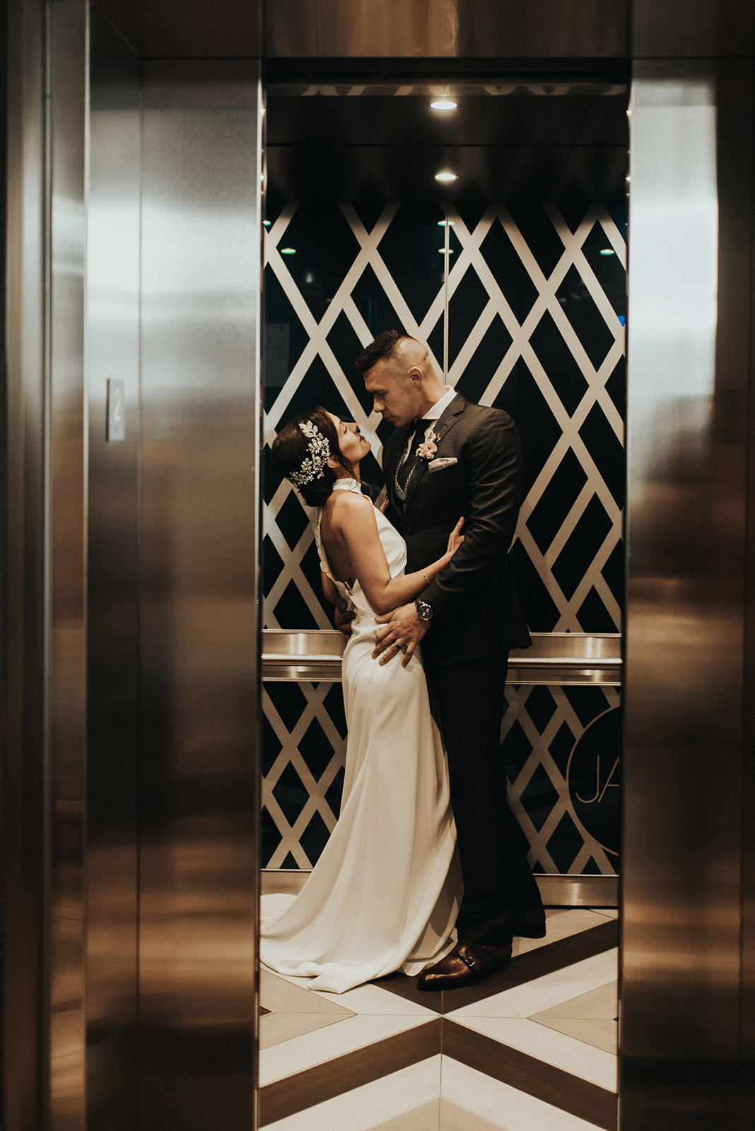 a man and woman in an elevator