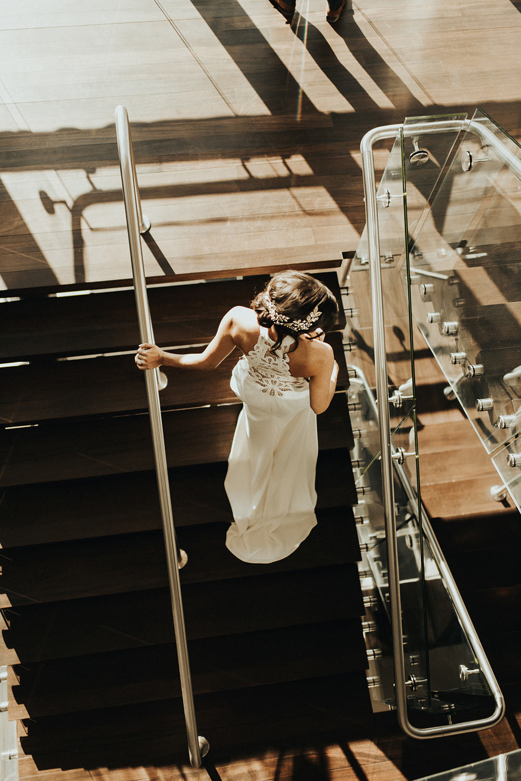 a woman in a white dress on a staircase main