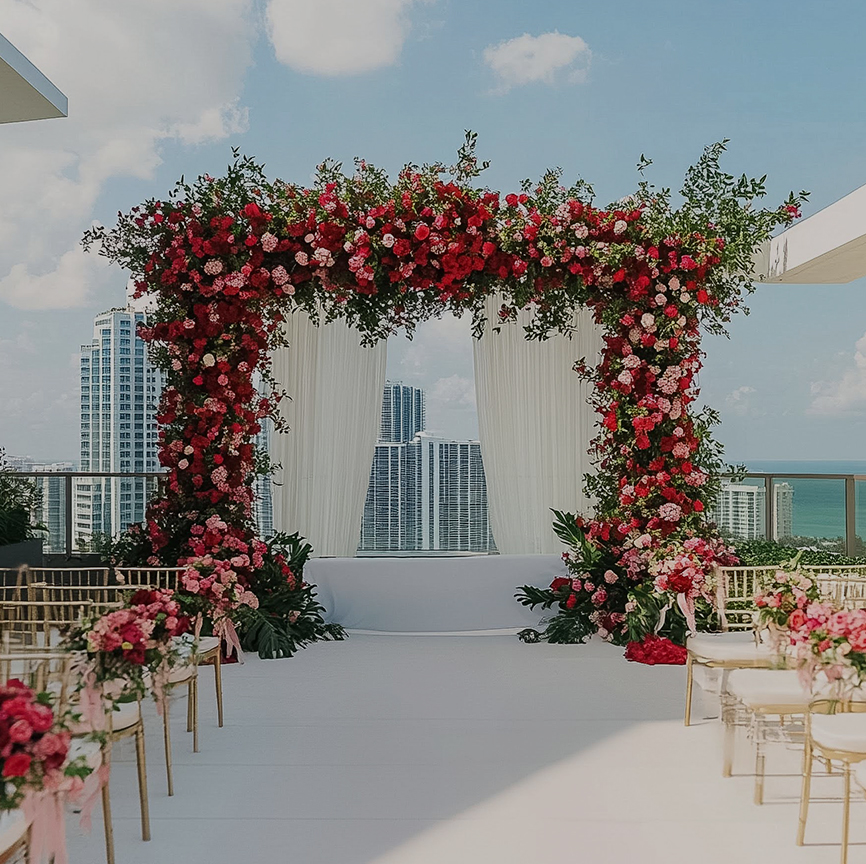 a wedding ceremony with flowers and chairs