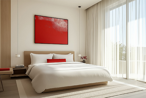a bed with a red painting above it
