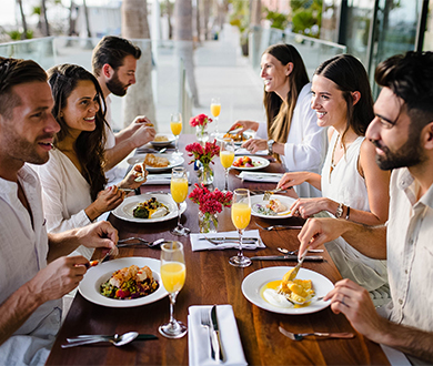a group of people eating at a table
