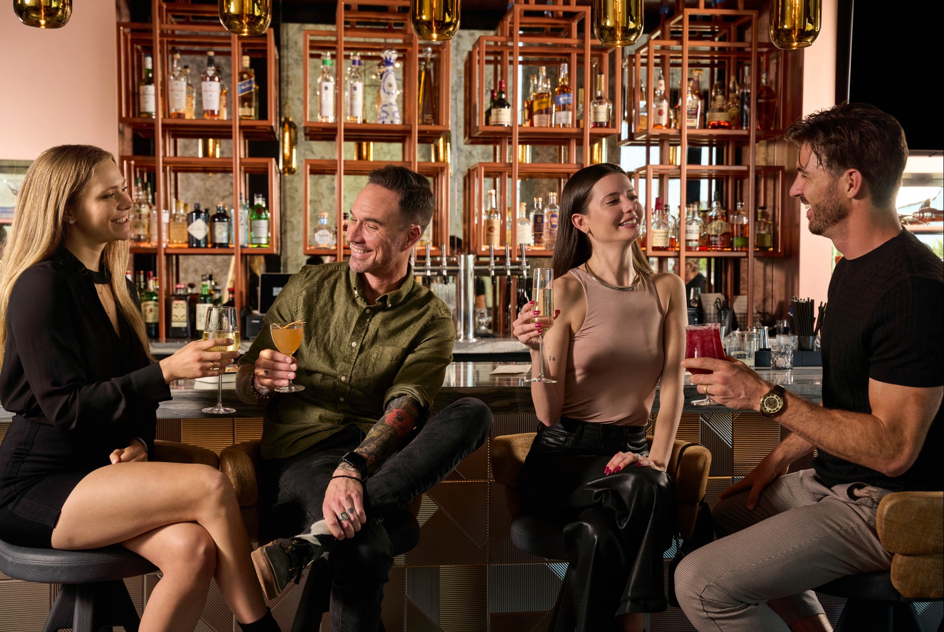 a group of people sitting at a bar
