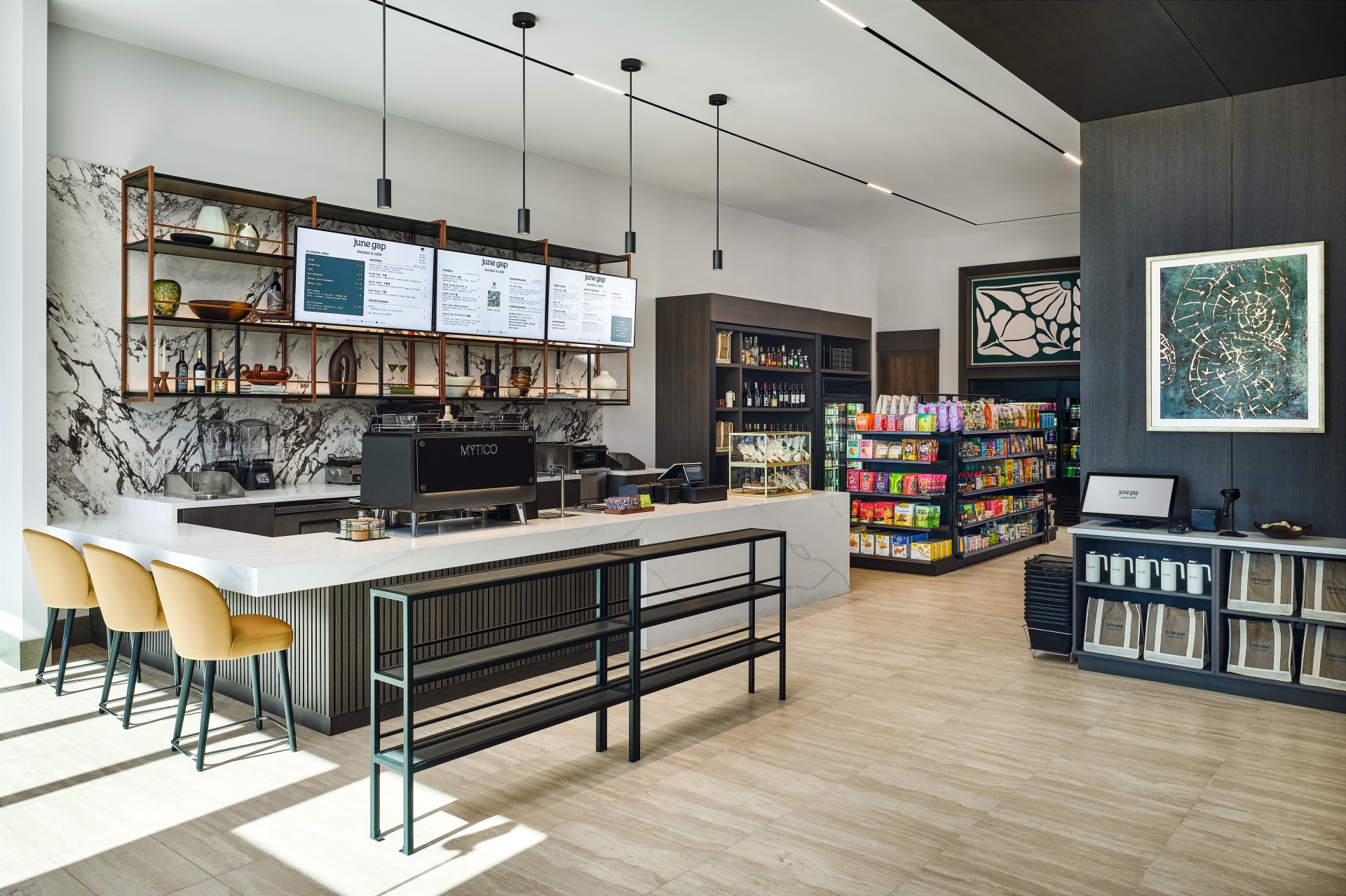 a coffee shop with shelves and shelves of food