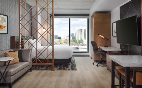 a room with a bed and a desk
