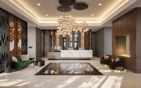 a lobby with a marble counter and a chandelier