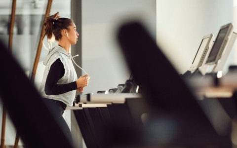 a woman running on treadmills