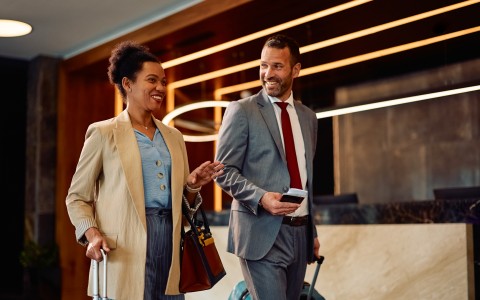 a man and woman in suits and ties