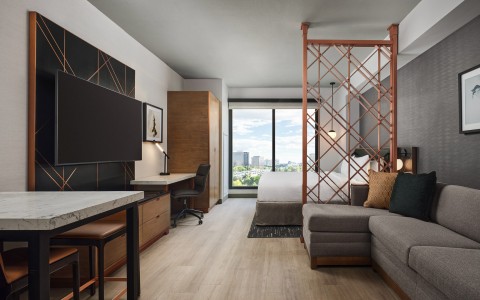 a room with a bed and a tv