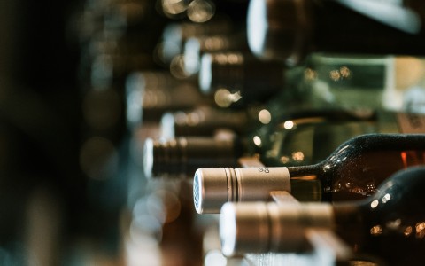 a row of bottles with metal caps