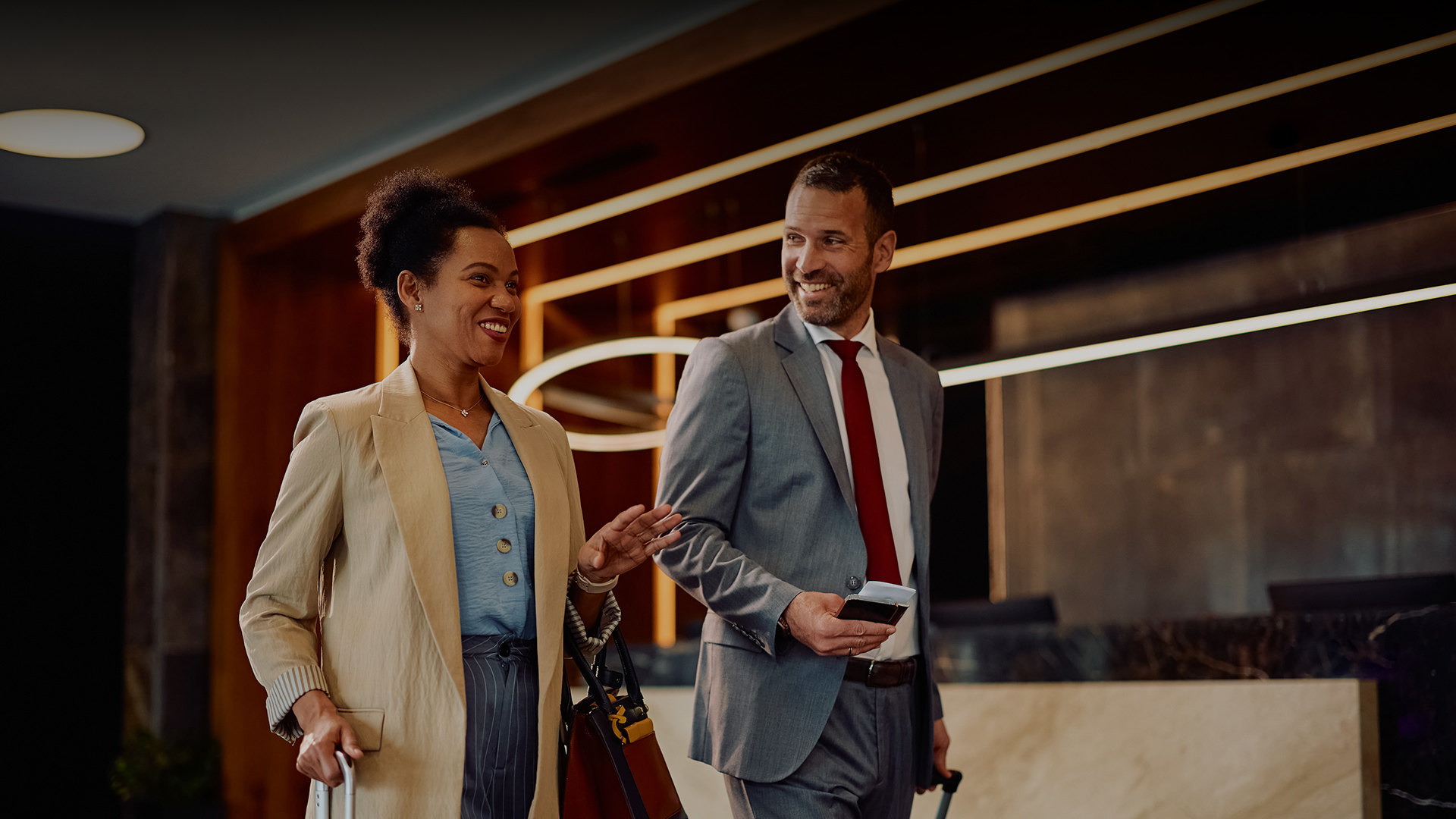 a man and woman in suits and ties