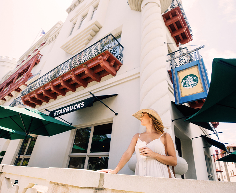 a woman standing in front of a building