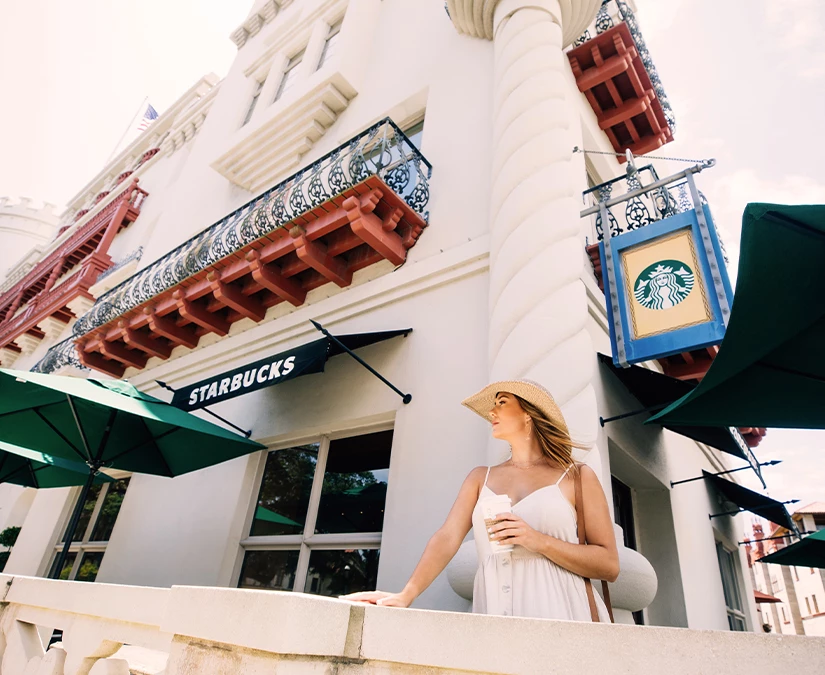 a woman standing in front of a building