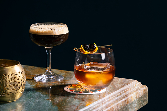 a glass of liquid and a glass of liquid on a marble surface