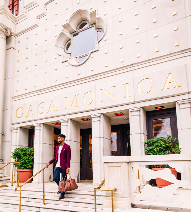 a man walking up stairs outside a building