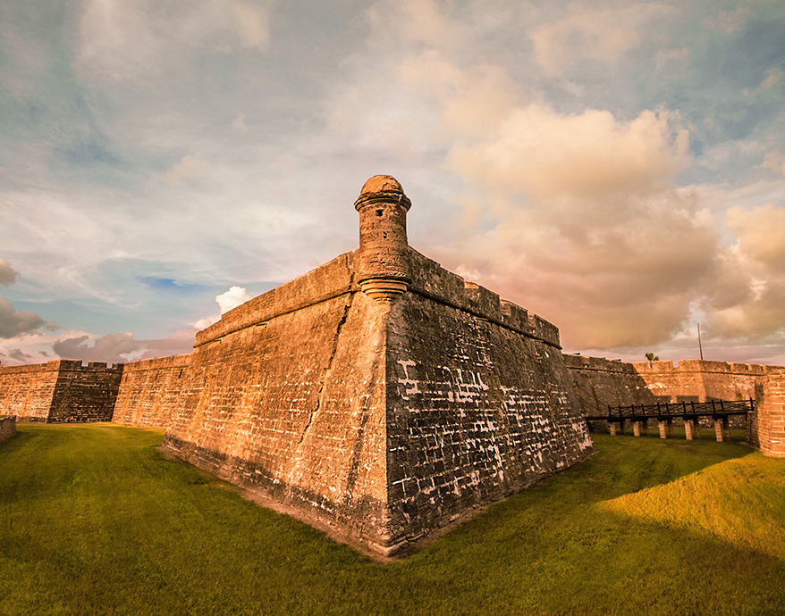 a stone wall with a tower on top