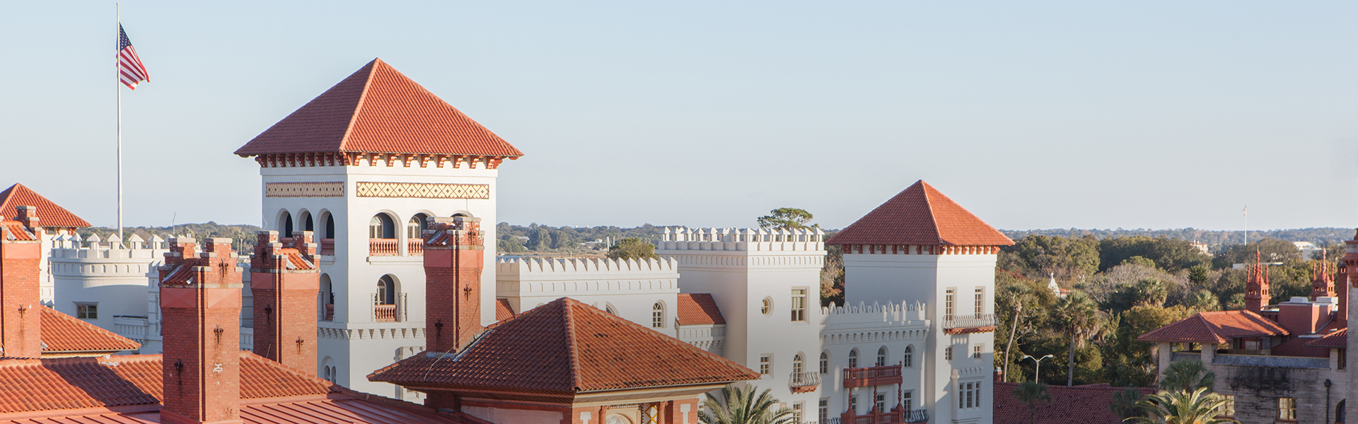 a white building with red roofs