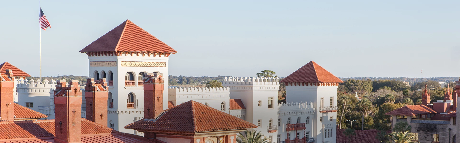 a white building with red roofs