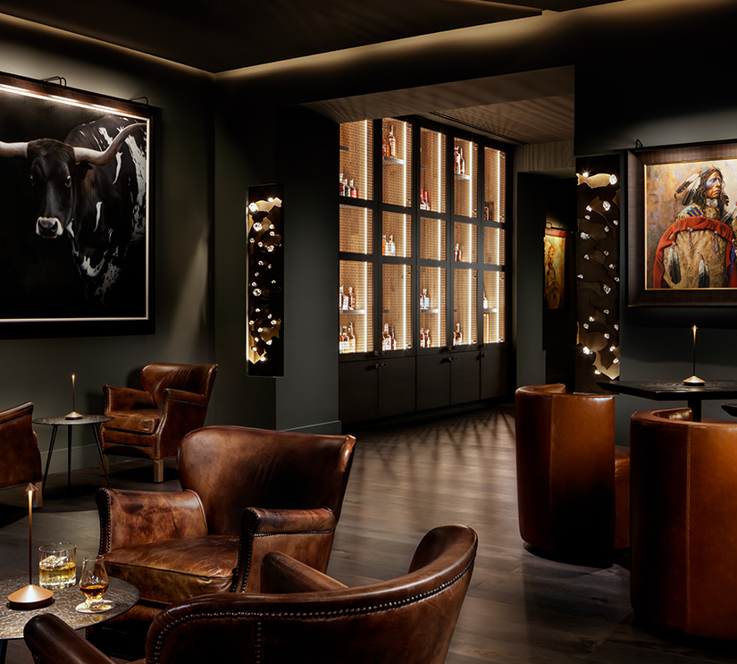 a room with chairs and a painting of a bull