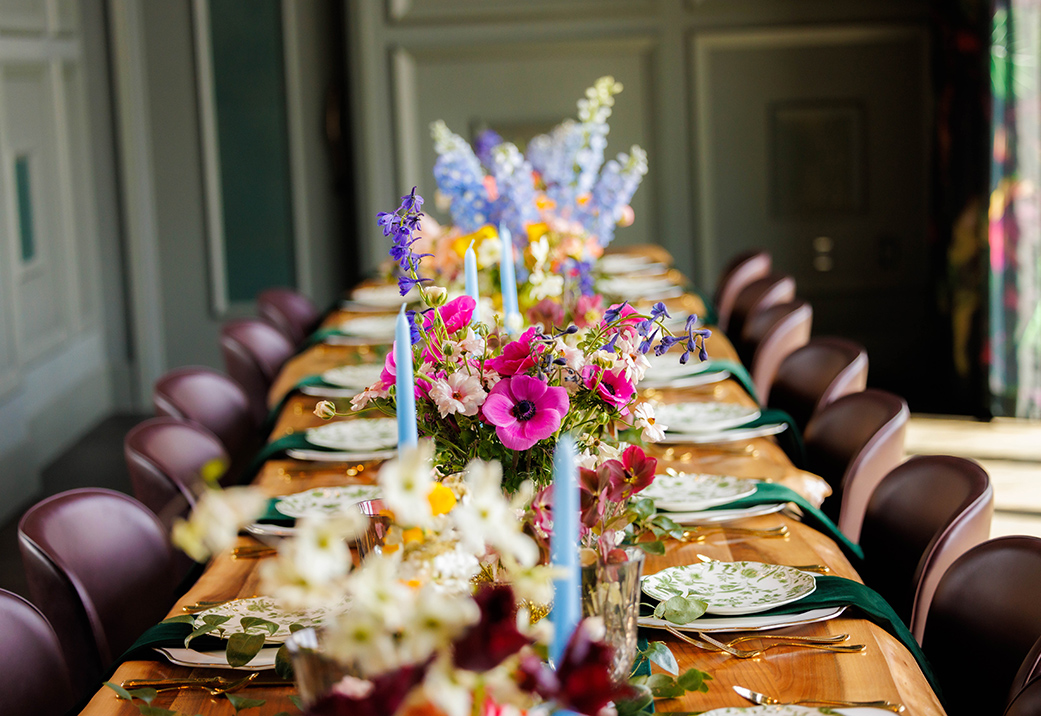 a long table with flowers on it