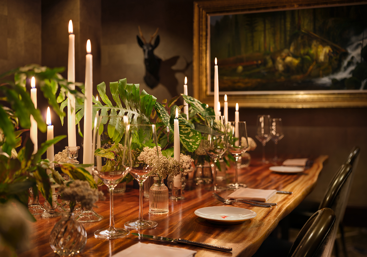 a table with candles and flowers