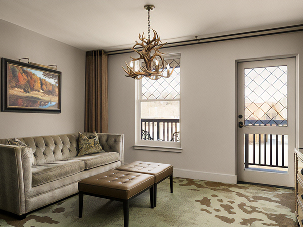 a living room with a chandelier and a couch