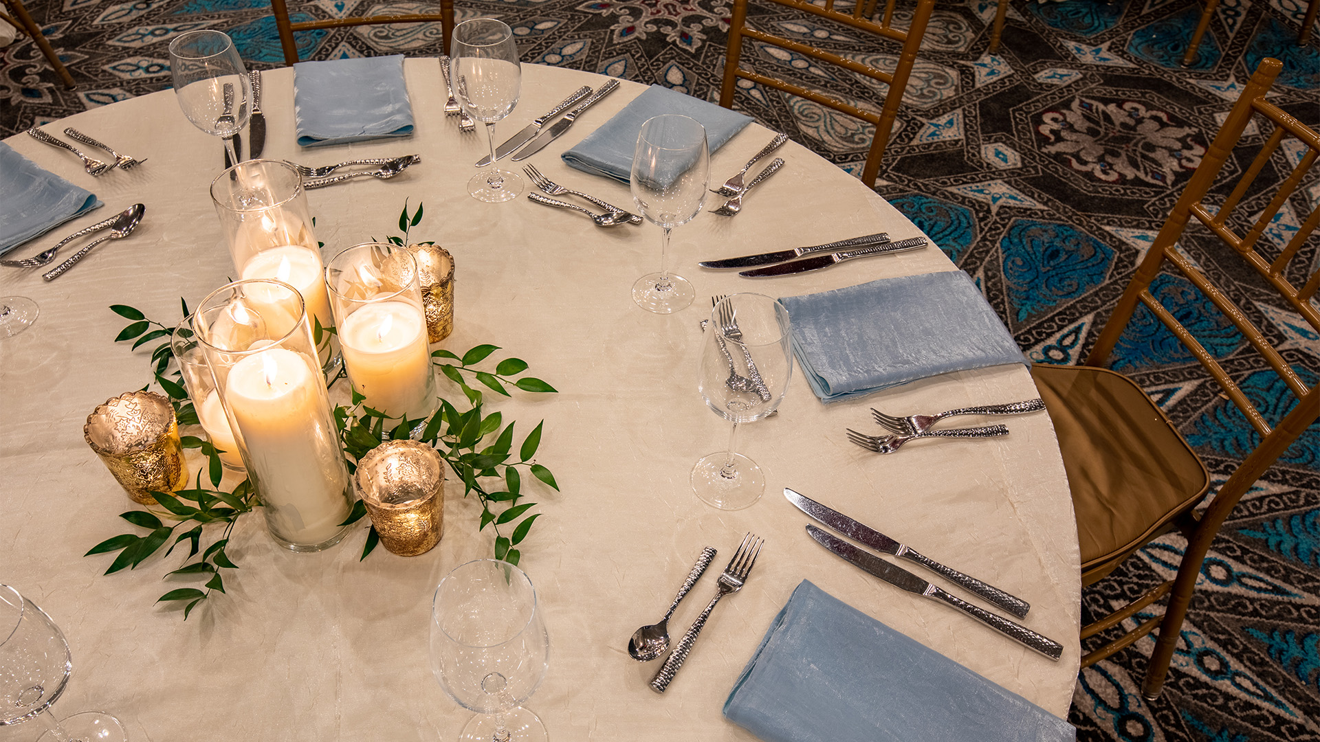 a table with candles and glasses