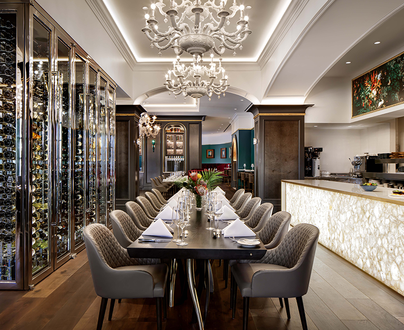 a dining room with a chandelier and a table