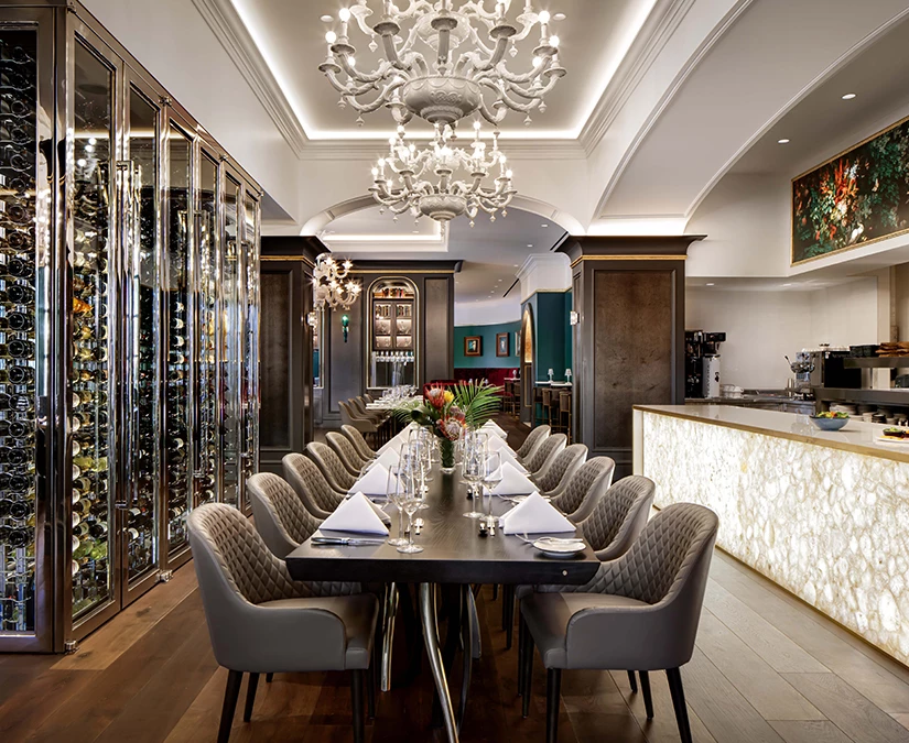 a dining room with a chandelier and a table