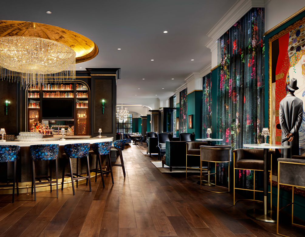 a room with a bar and chairs