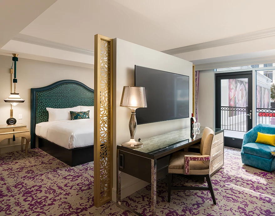 a room with a tv and a bed