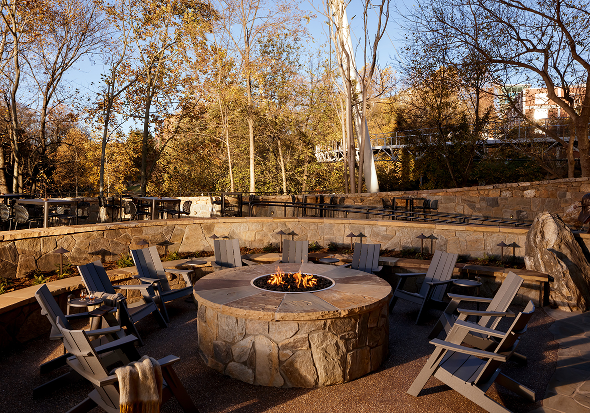 a fire pit with chairs around it
