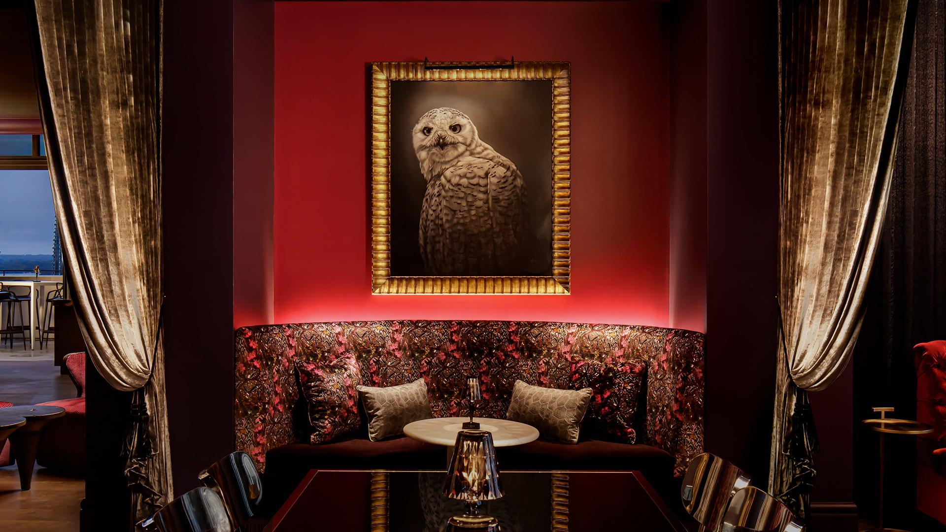 a framed picture of an owl on a wall