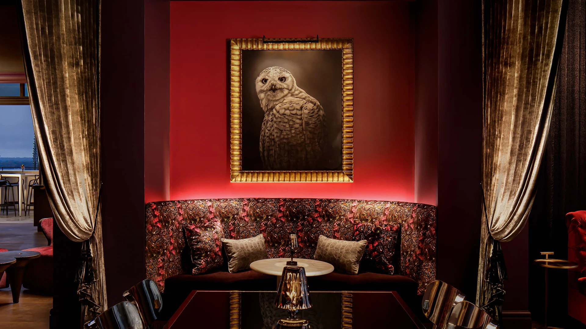 a framed picture of an owl on a wall