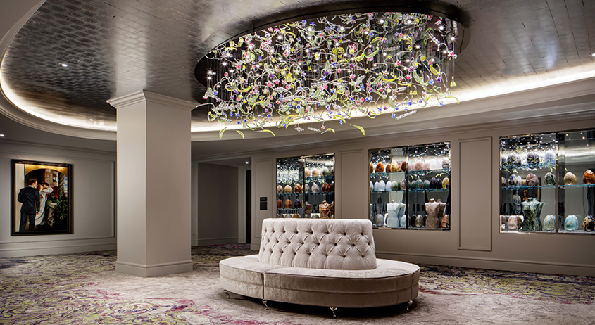 a chandelier above a couch