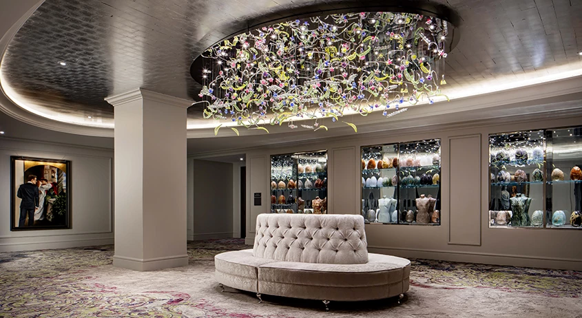 a chandelier above a couch