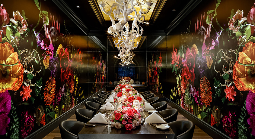 a long table with flowers on it
