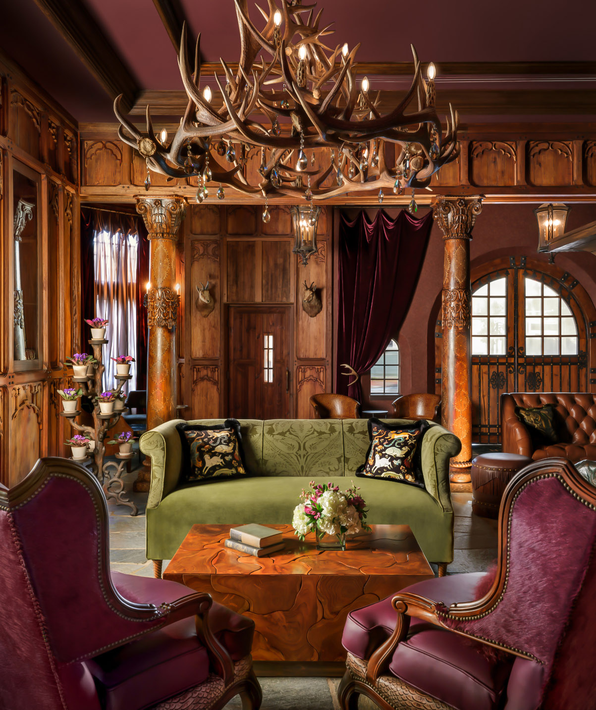 a room with a chandelier and couches