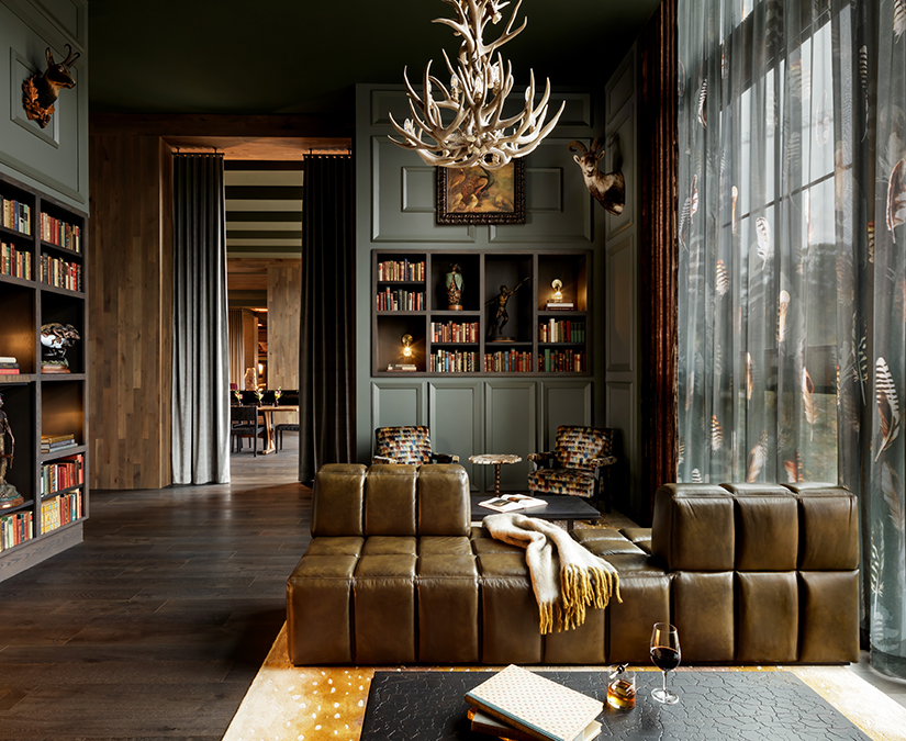 a living room with a couch and a chandelier