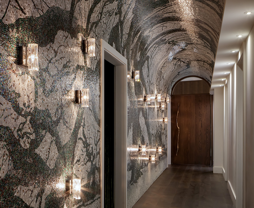 a hallway with lights on the wall