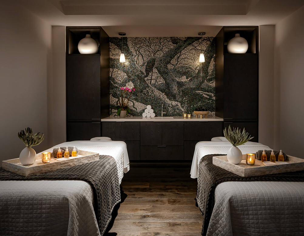 a room with beds and candles