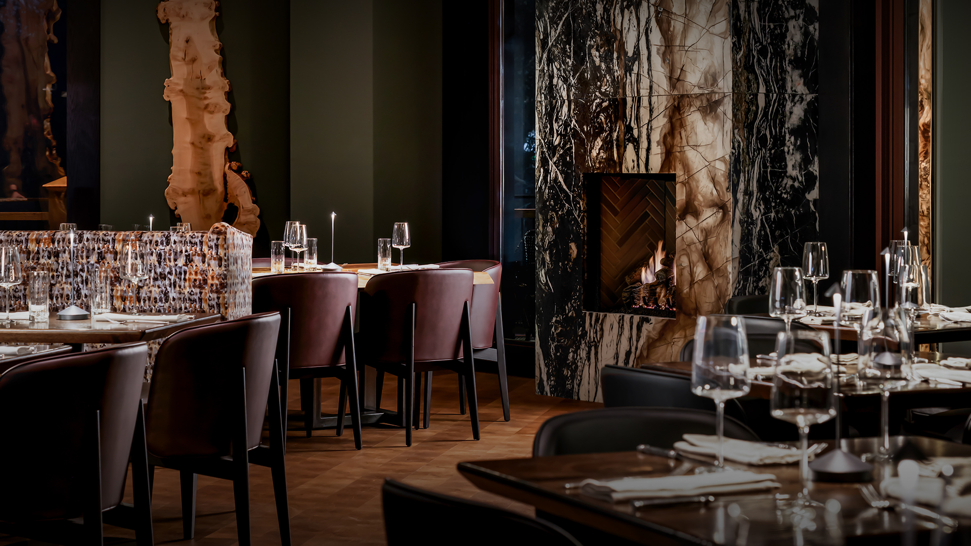 a restaurant with a fireplace and chairs