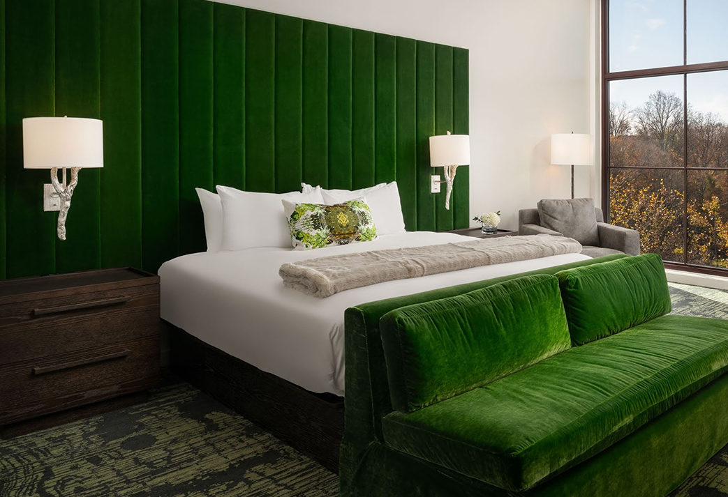 a bed with a green headboard