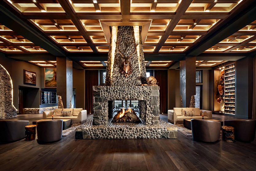 a fireplace in a room with a wood floor and ceiling