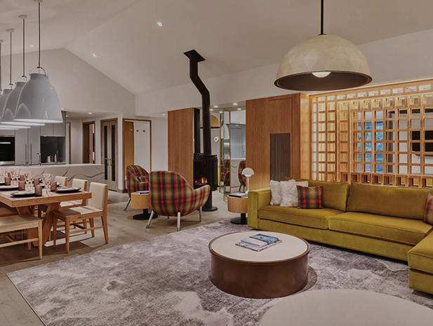 a living room with a fireplace and a green couch