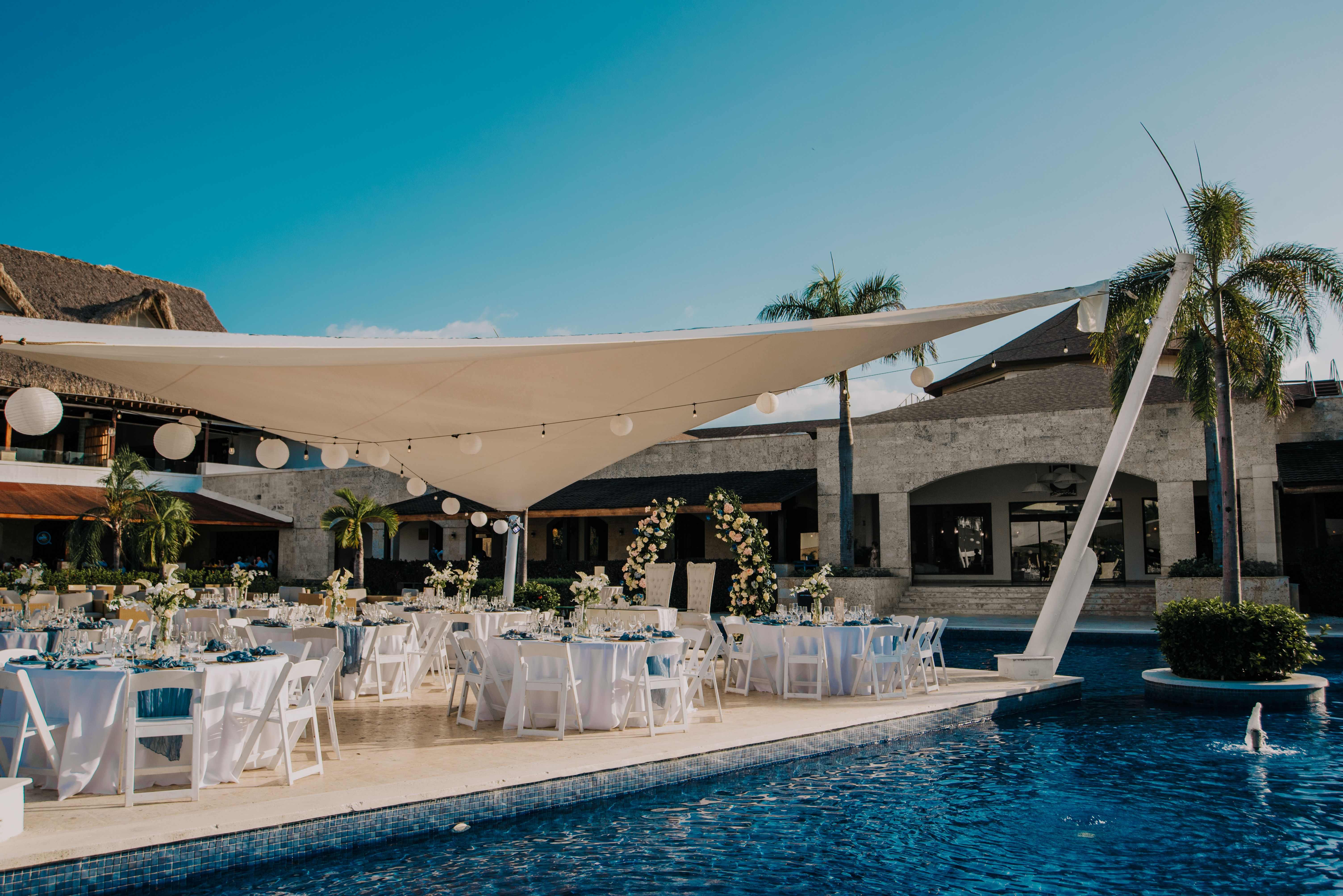 a pool with tables and chairs