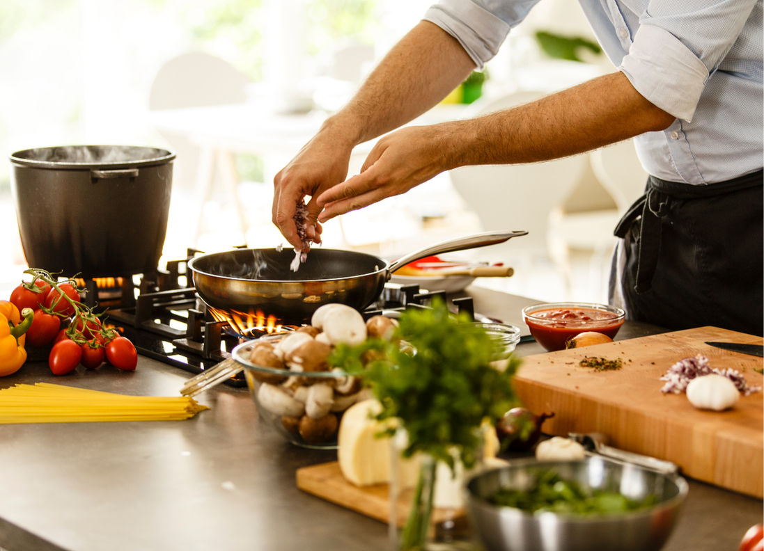 a person cooking in a kitchen